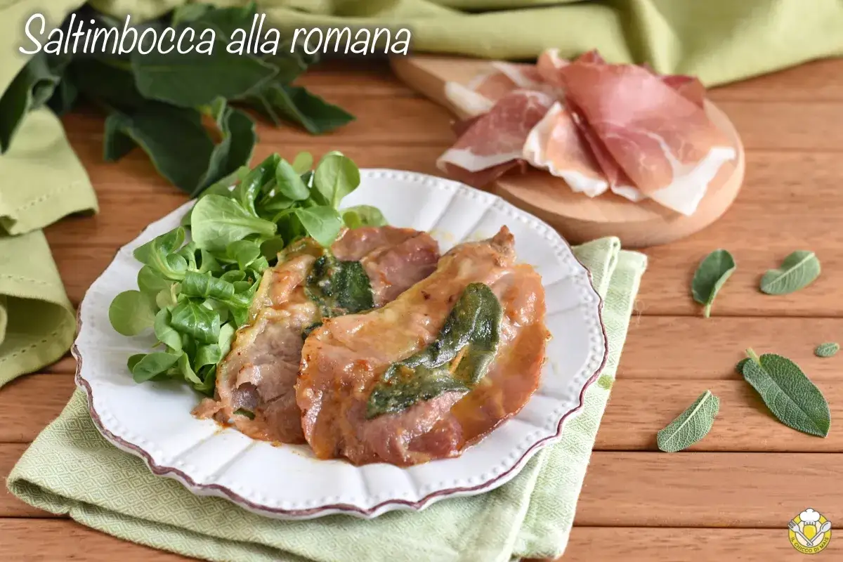 Saltimbocca alla romana: fettine di vitello con prosciutto e salvia, servite con insalata fresca.